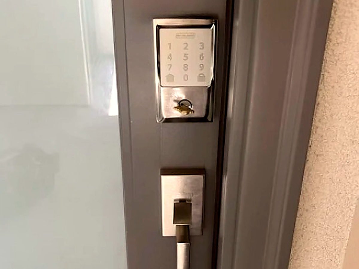 Keypad deadbolt and matching handle set fitted to a business entrance door in San Diego